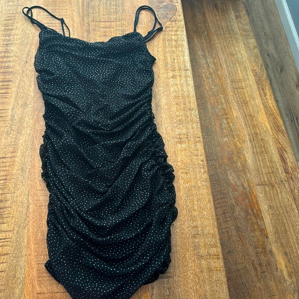 Black ruched mini dress with sparkly detail, size Medium.